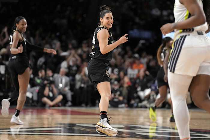 Las Vegas Aces guard Kelsey Plum smiles after a play.